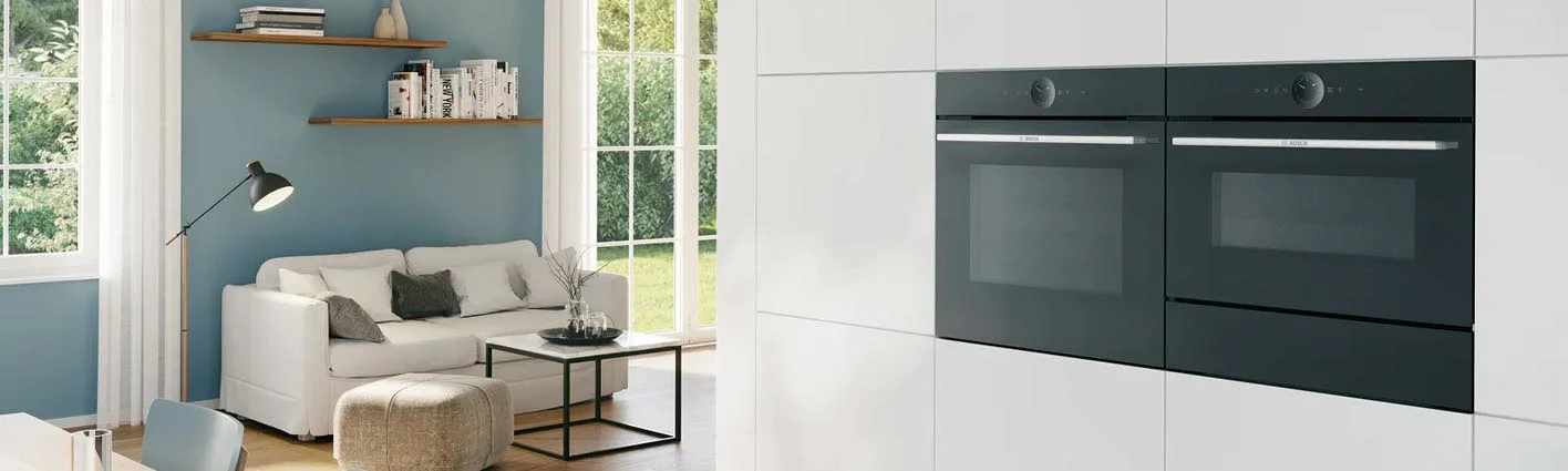 A built-in oven placed high up in a kitchen.