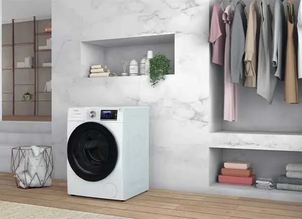 A tumble dryer in a room.