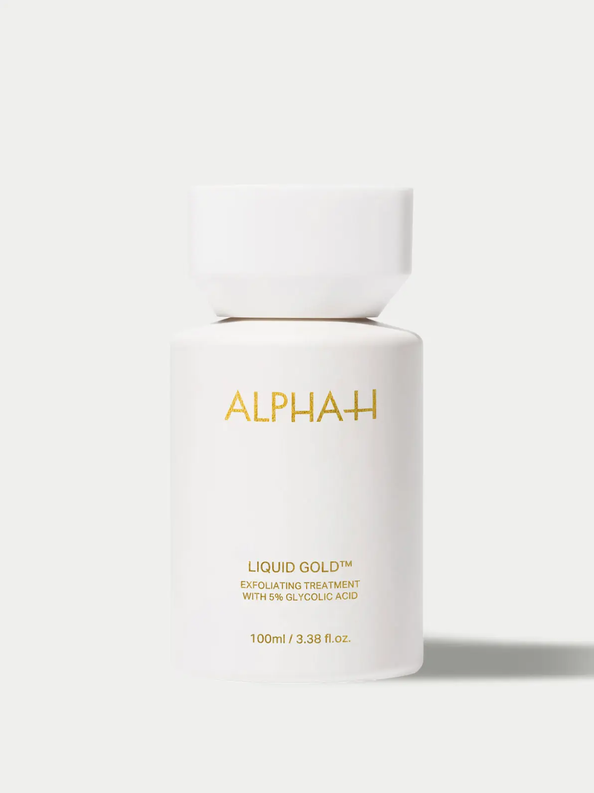Exfoliating treatment in white and gold bottle 