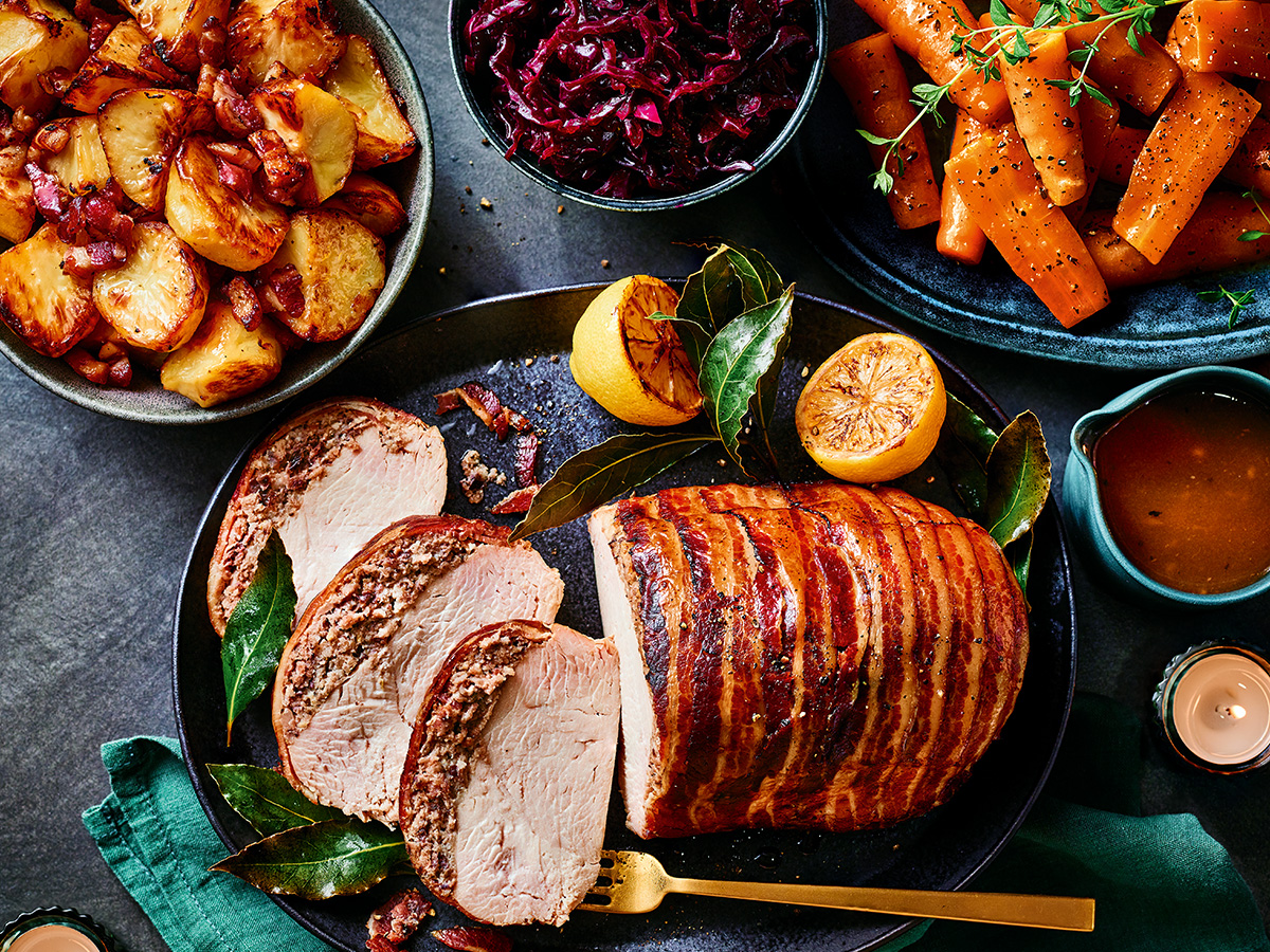 A plate of Christmas dinner with roast potatoes and red cabbage