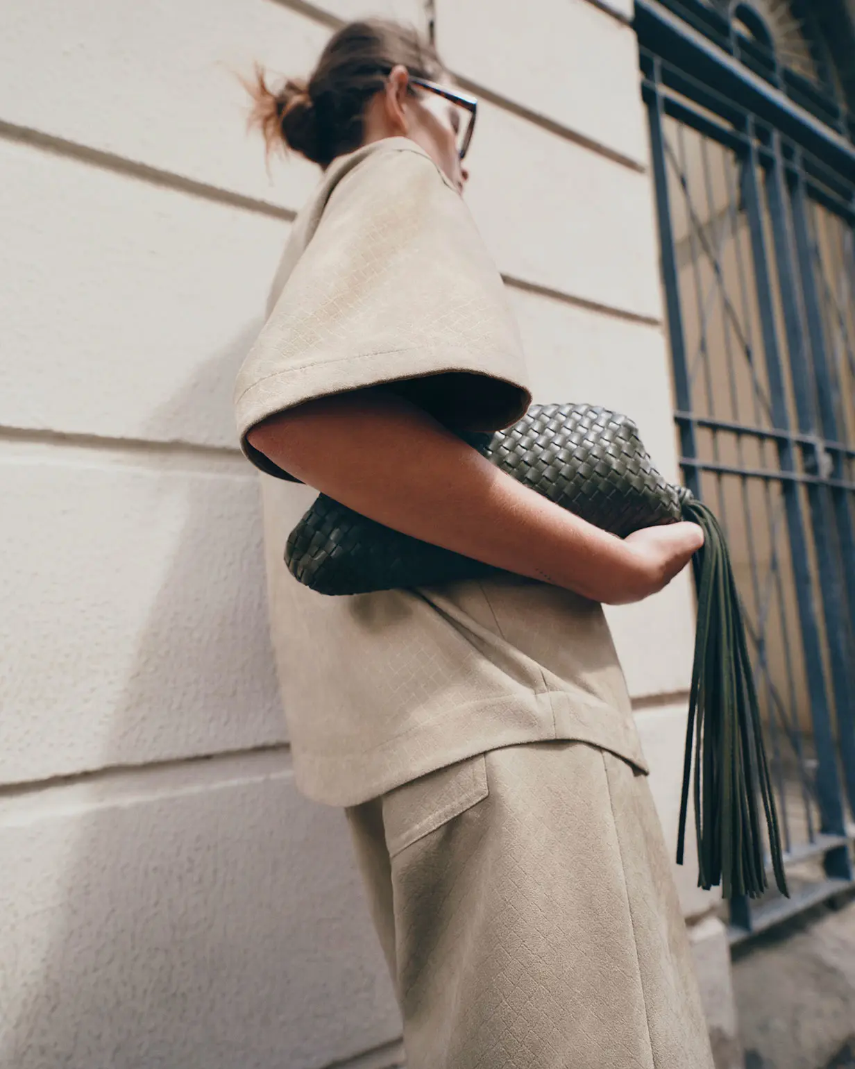 Woman wearing suedette shirt and matching shorts