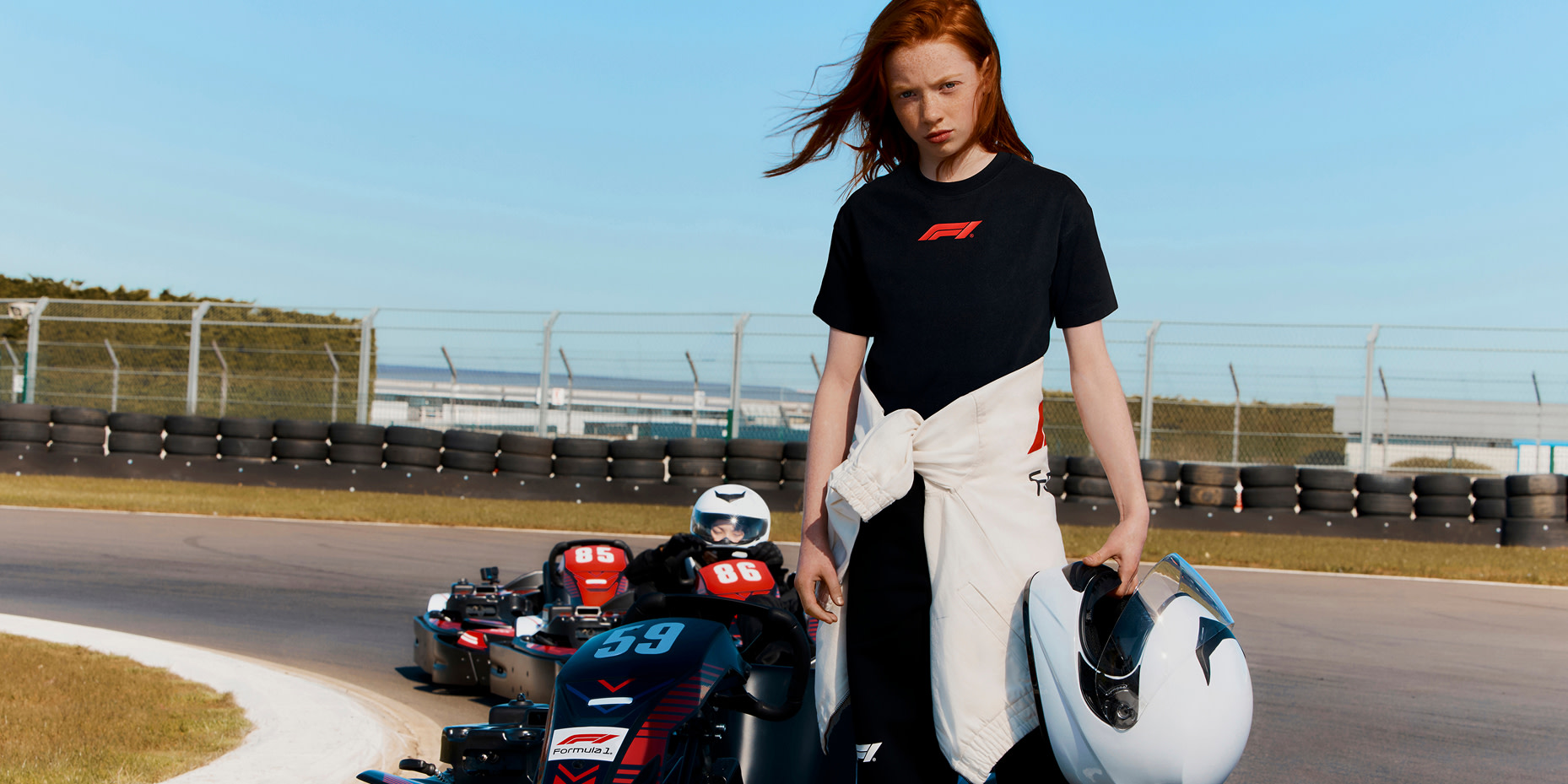 Girl standing on race track 