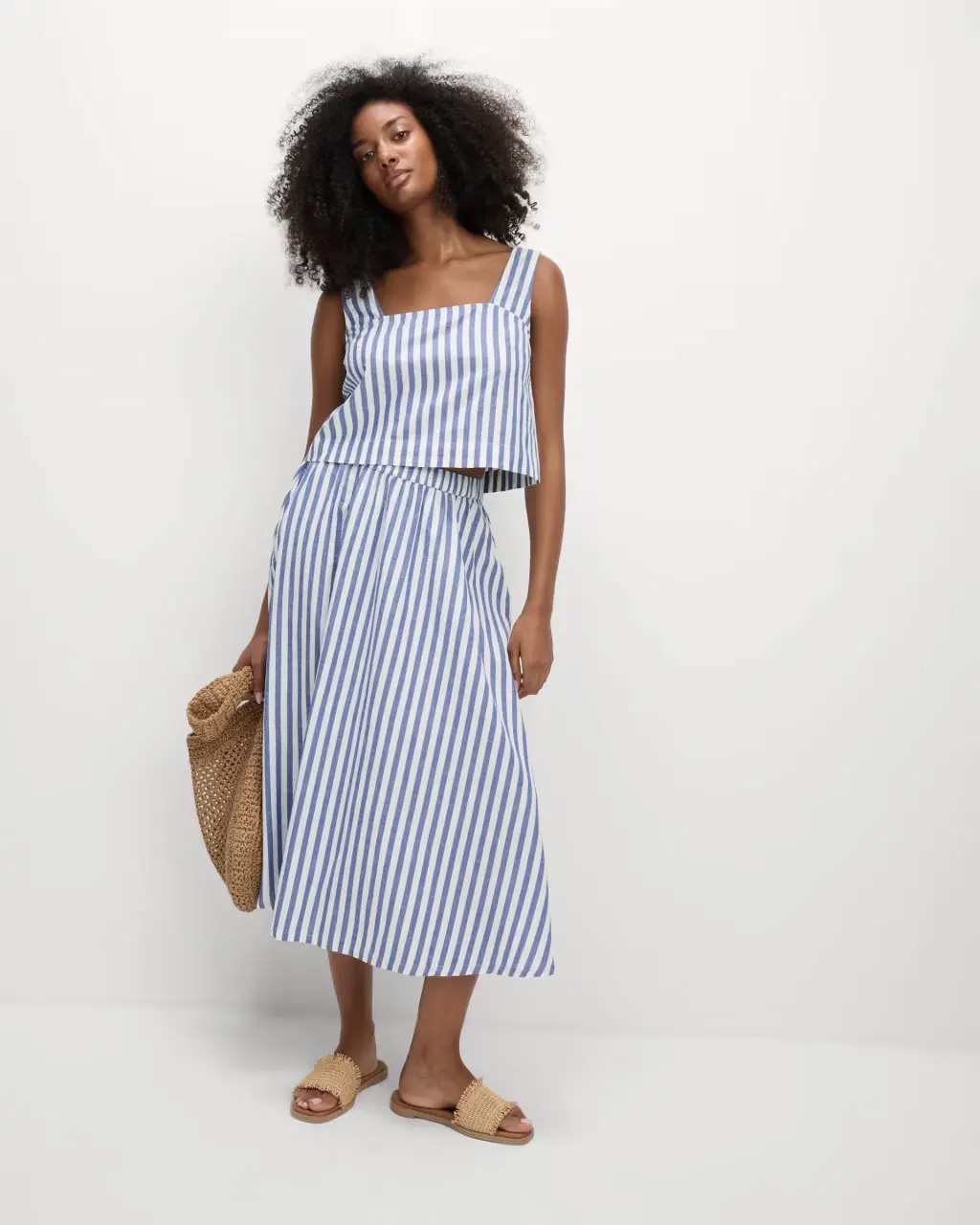 Woman wearing a blue and white skirt and matching top