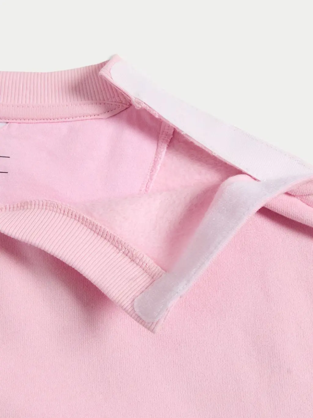 A close up of a velcro fastening of a kid's sweatshirt