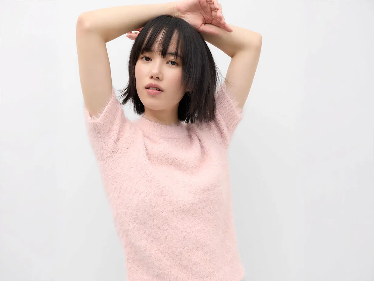 Woman wearing pink jumper