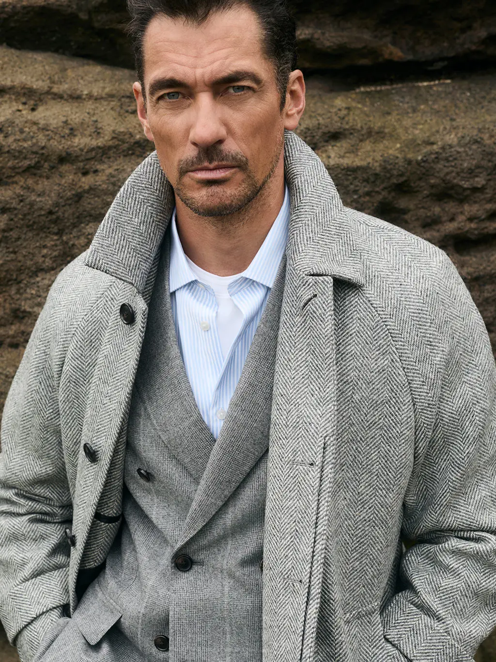 Man in grey suit and coat