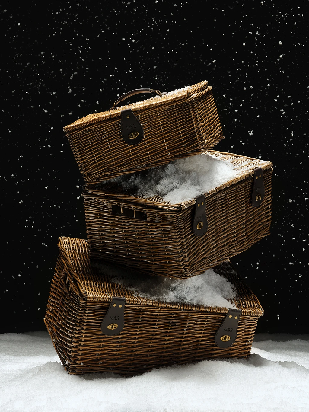 Three rattan hampers stacked on top of each other