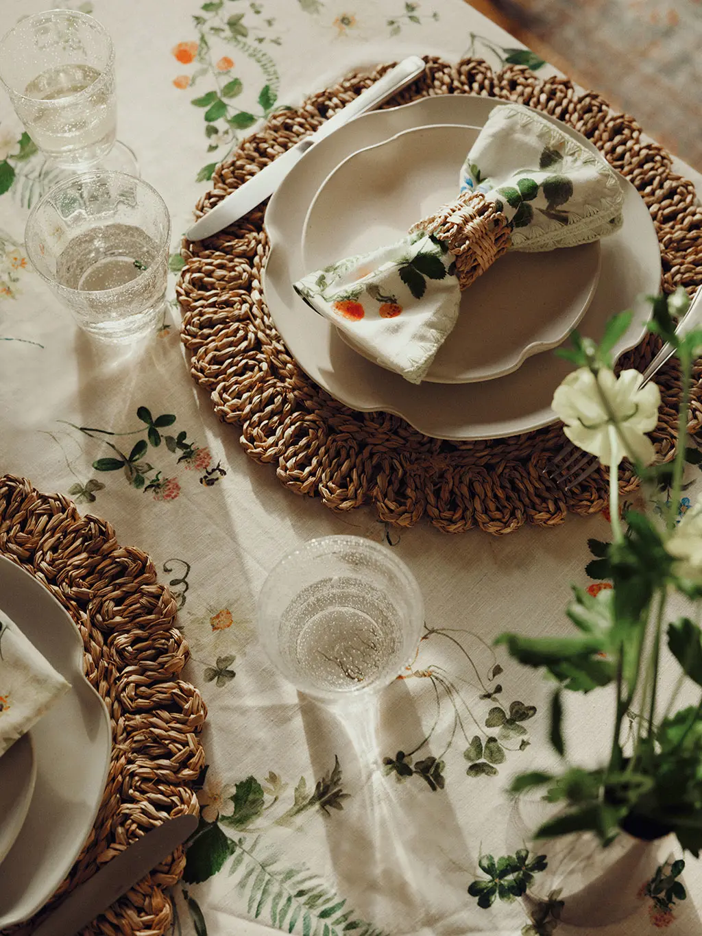 Table with floral tablecloth and napkins