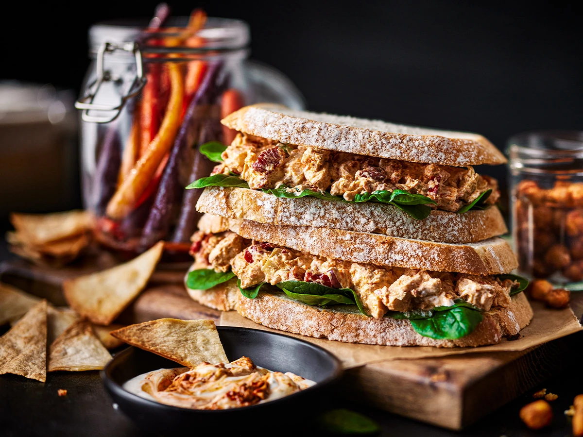 a sandwich and roasted carrots and crispy chickpeas