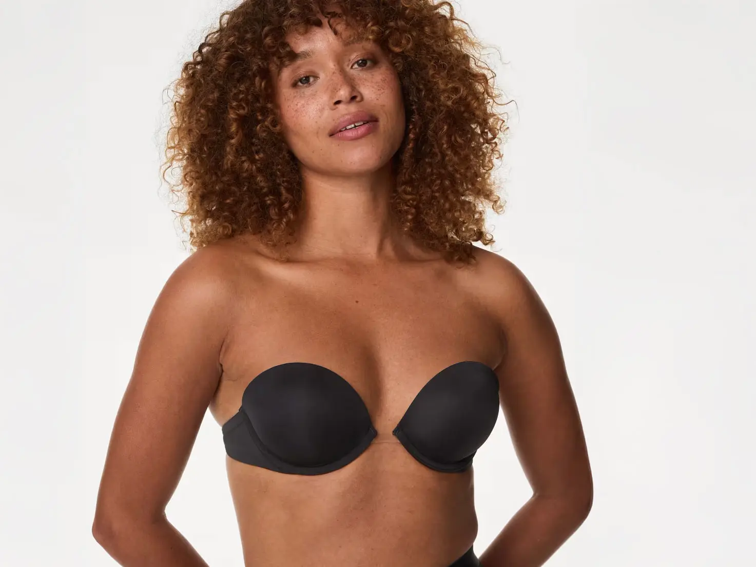 Woman wearing black strapless bra