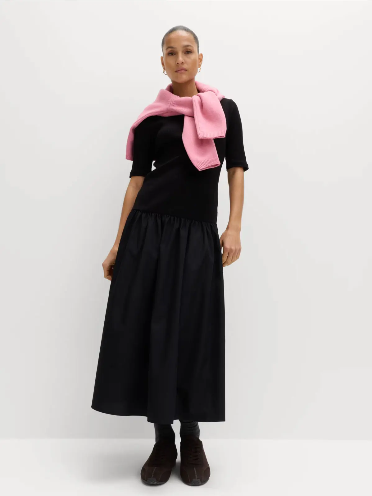 Woman wearing a midi-length black dress