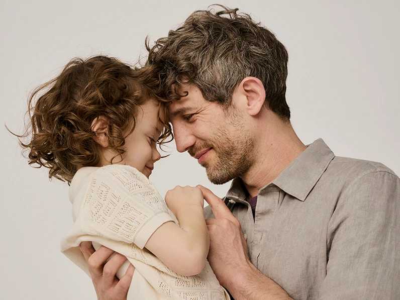 Father and son wearing co-ordinating shirts