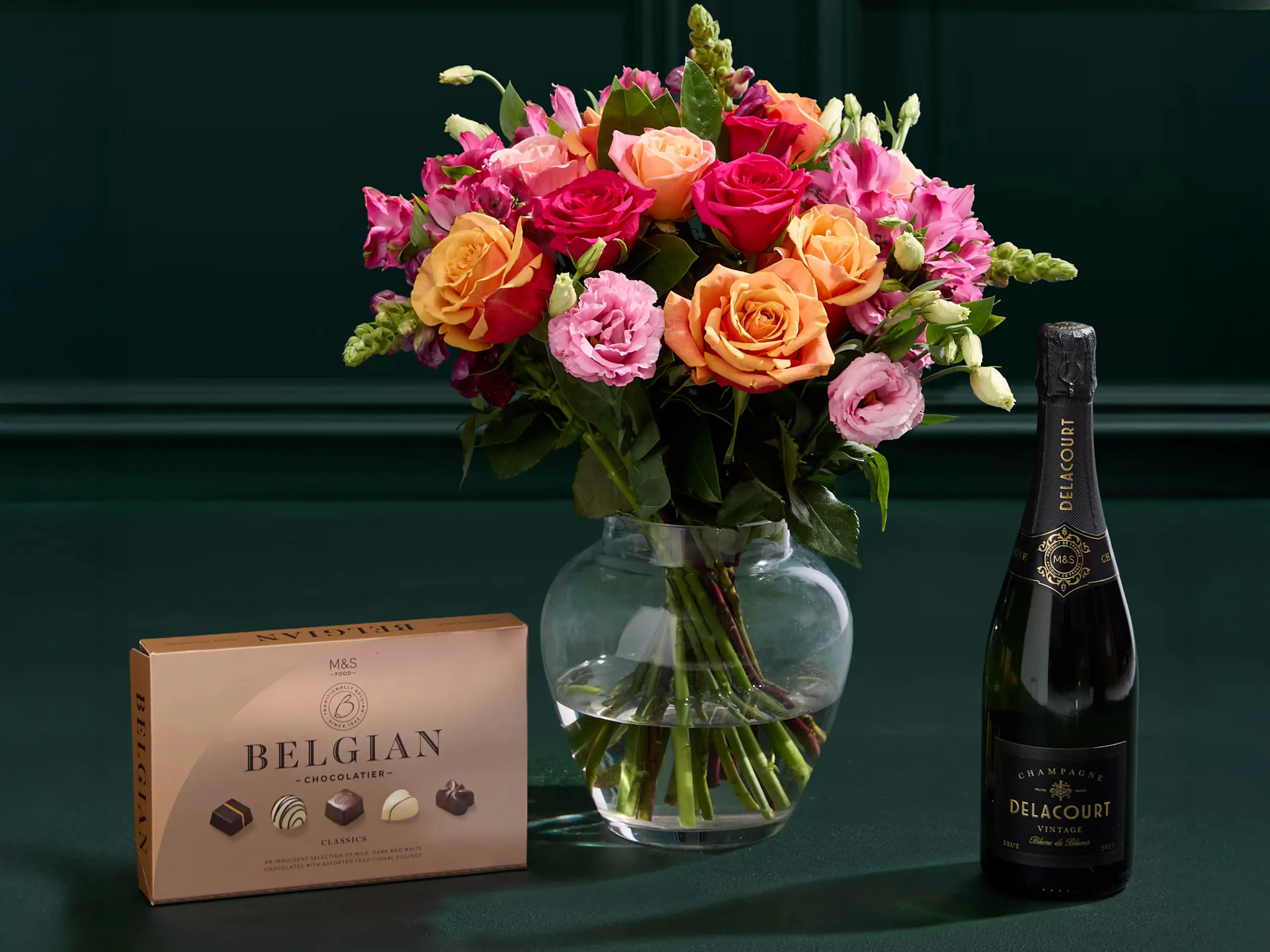 Roses gift bouquet with champagne and chocolate 