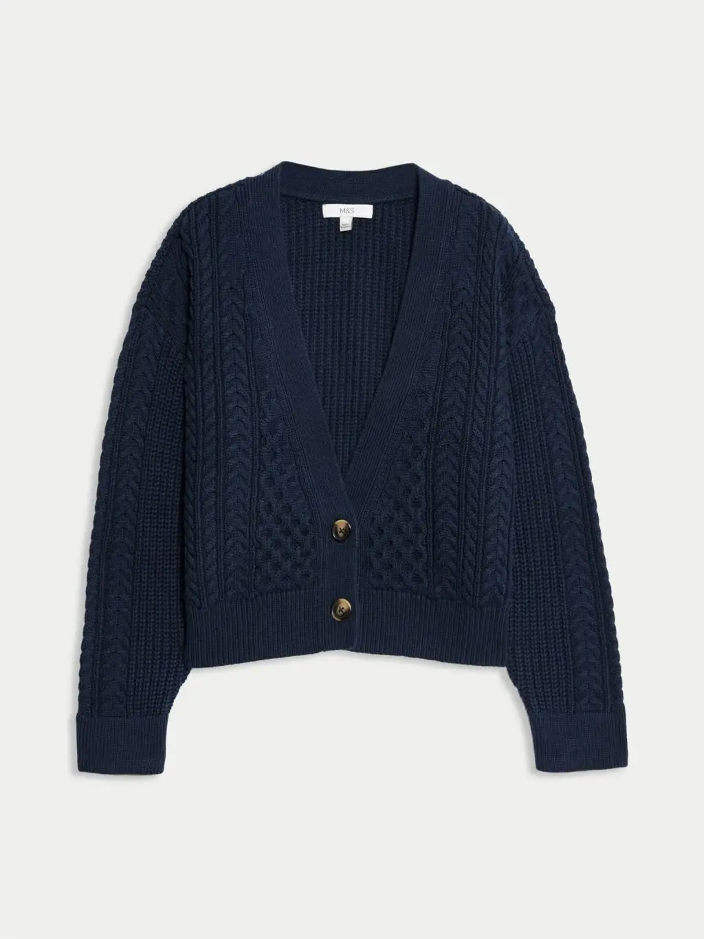 A cutout of a navy cable cardigan by M&S