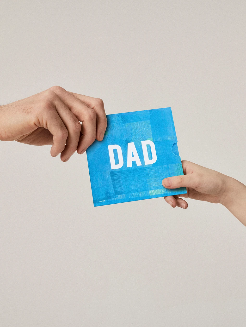 Man receiving Father's Day gift card from M&S