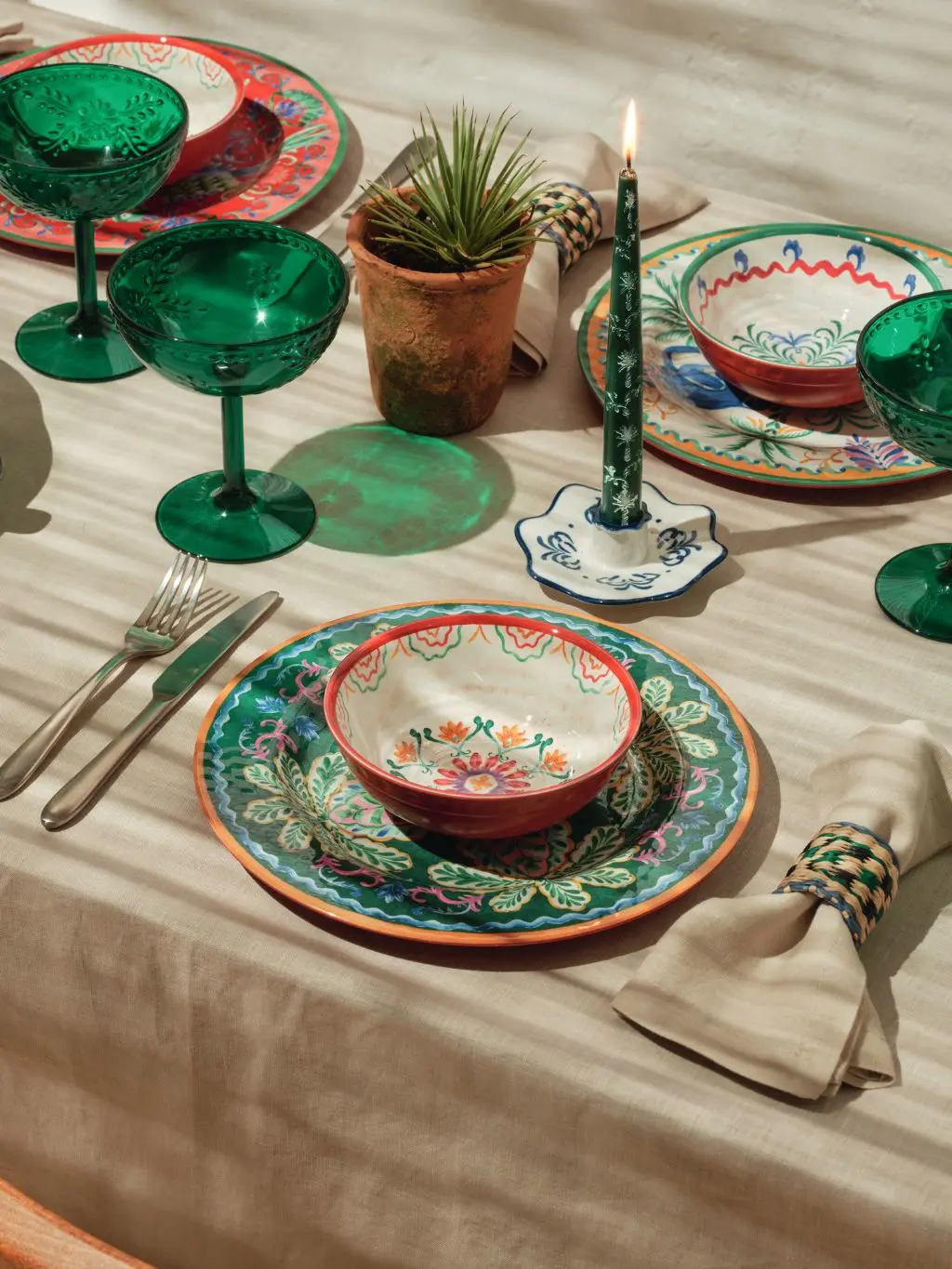 A table decorated with brightly coloured tableware