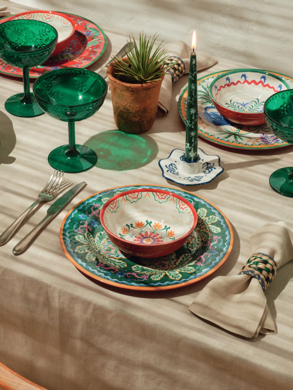 A table decorated with brightly coloured tableware