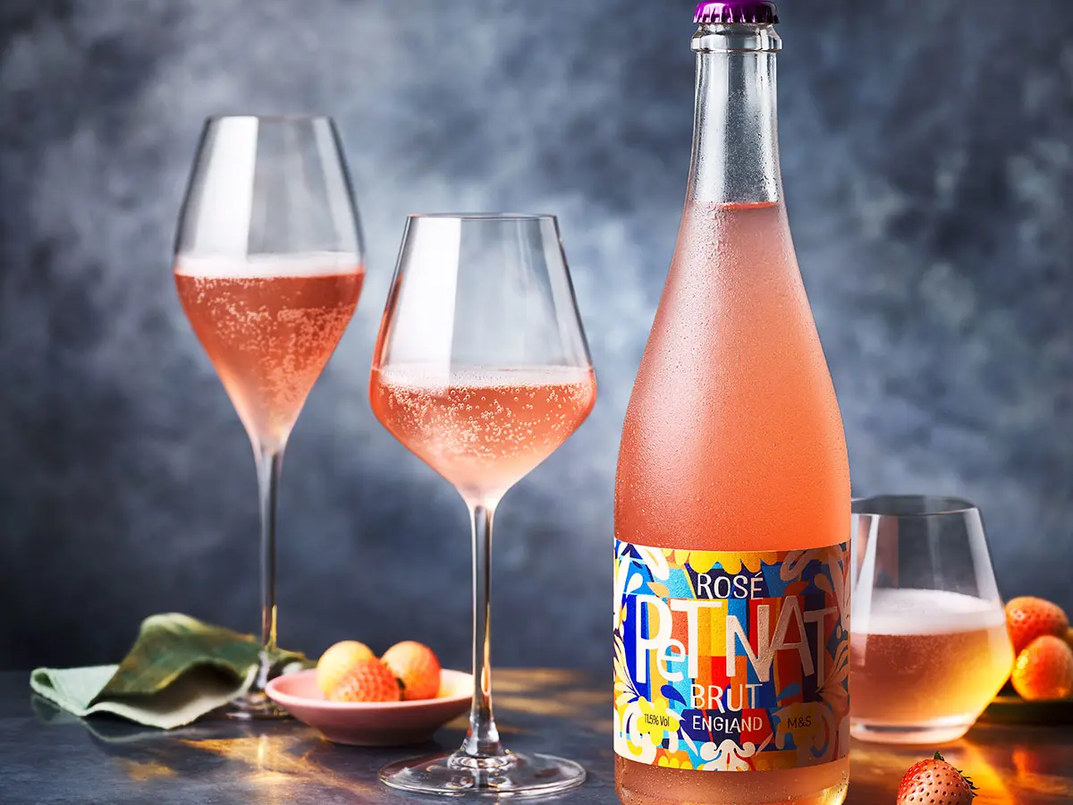 A bottle of Pét Nat rosé and glasses.