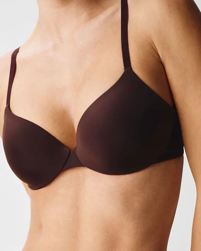 Woman wearing demi-cup bra