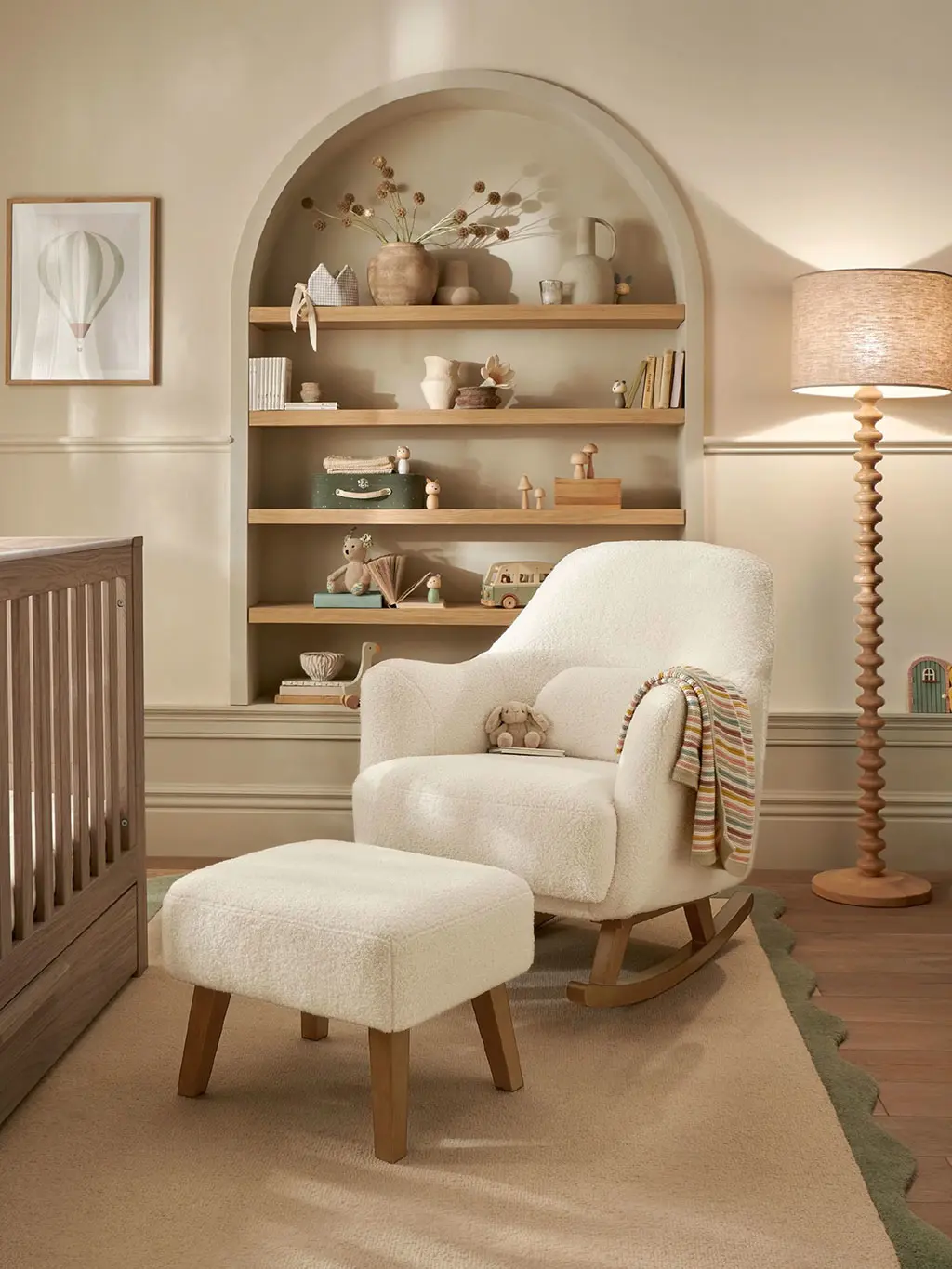Neutral nursery with decorated shelving