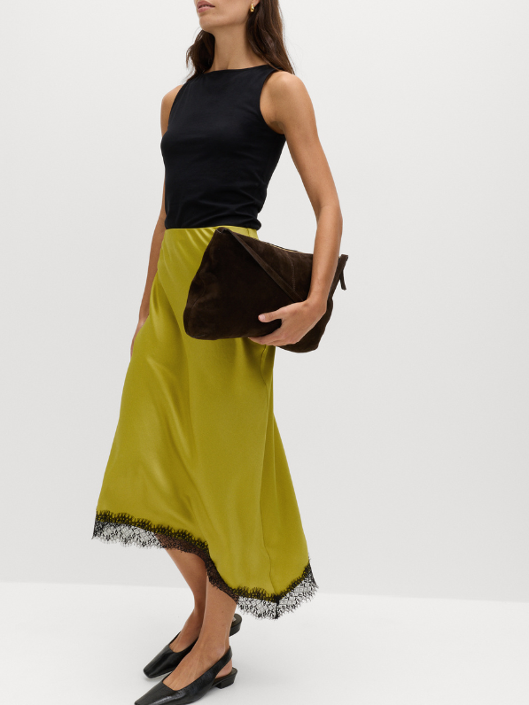 Woman wearing lace insert skirt