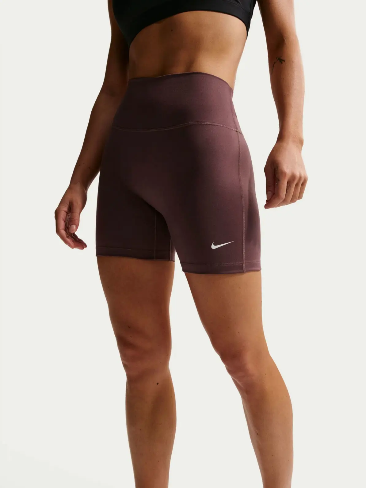 Woman wearing brown sports shorts