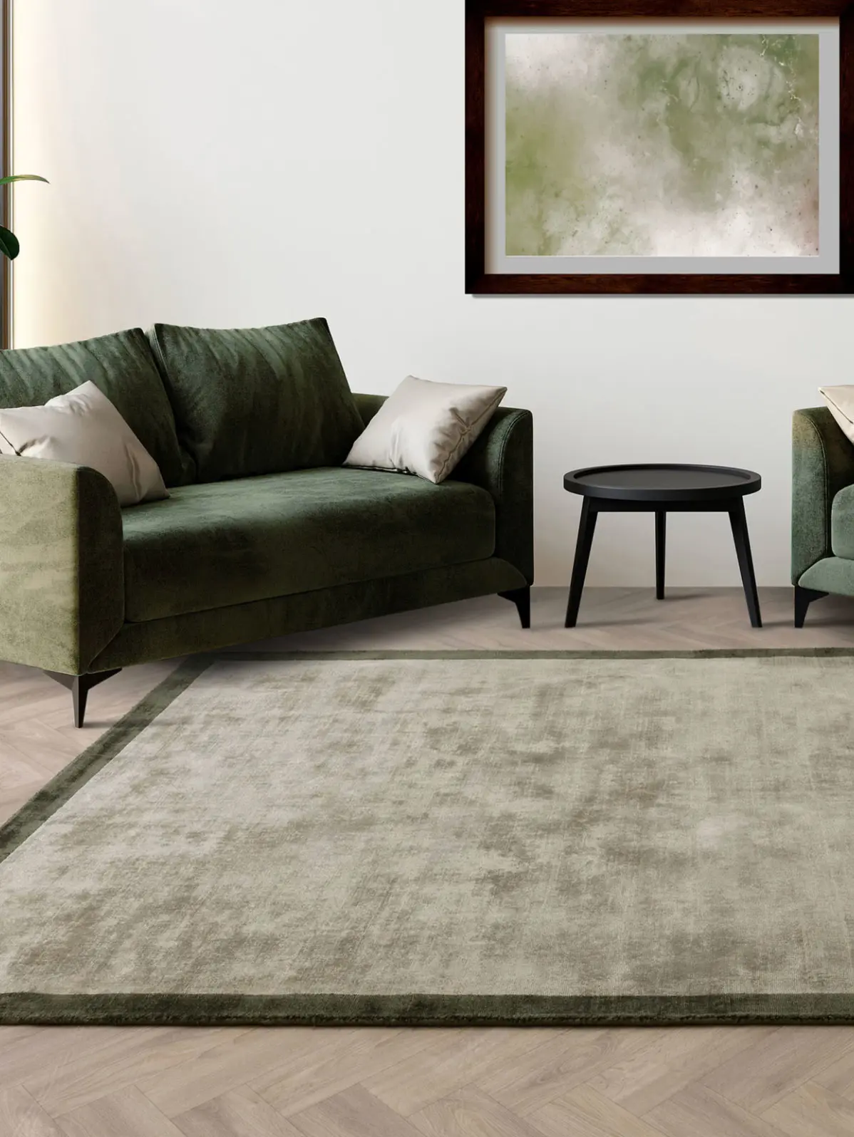 Green sofa with matching green rug and wall art 