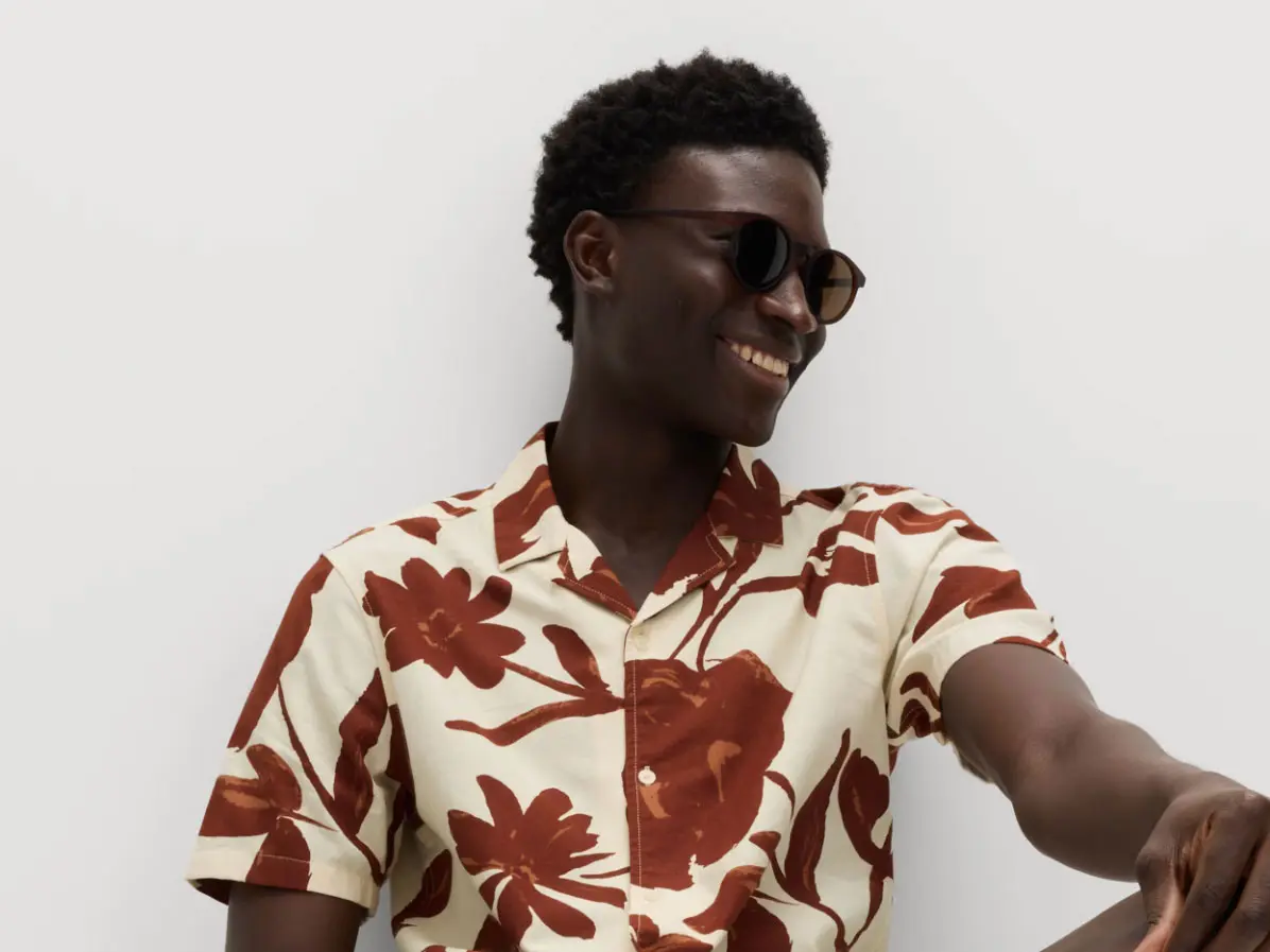 Man wearing sunglasses and printed shirt 
