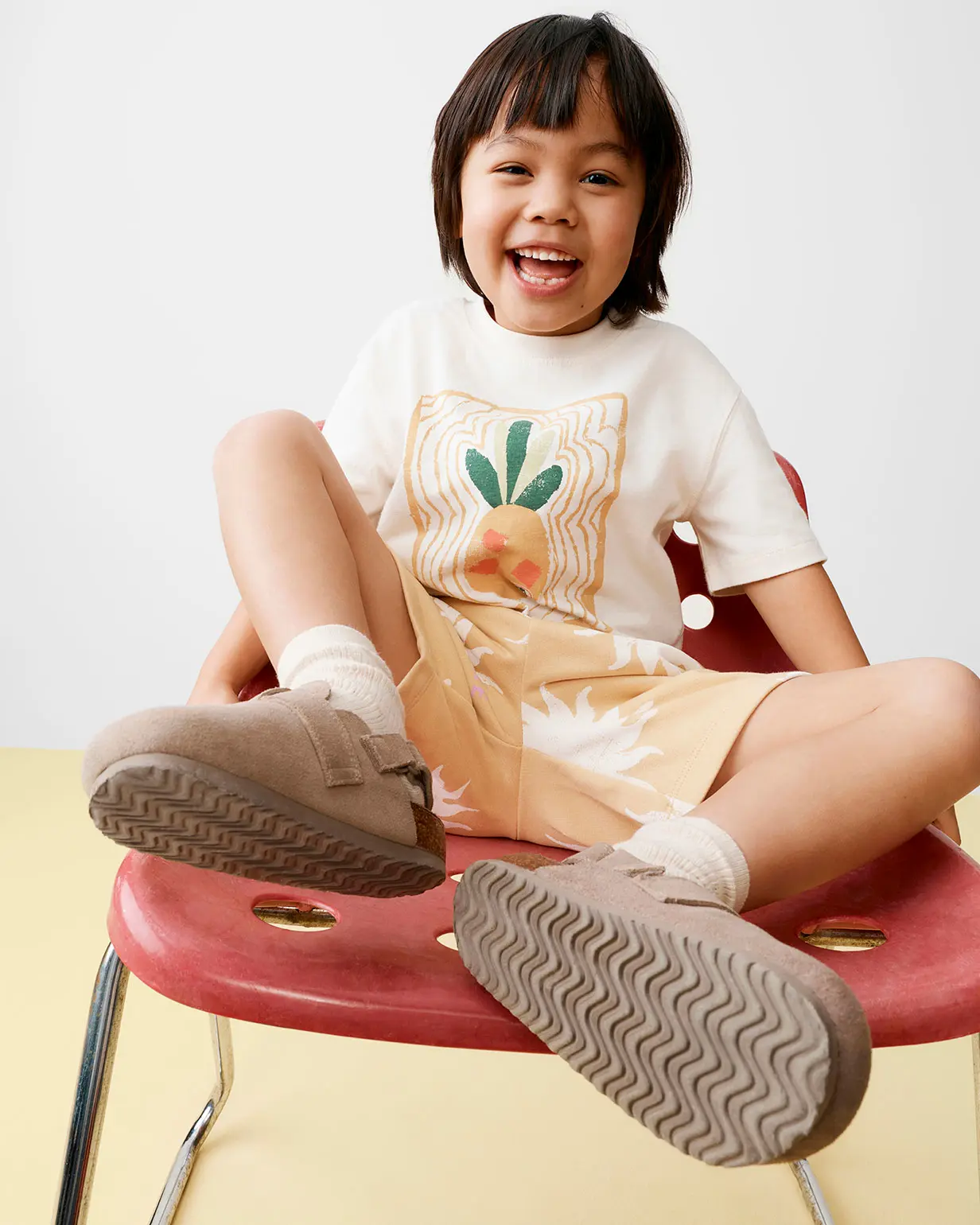 Boy wearing T-shirt and shorts