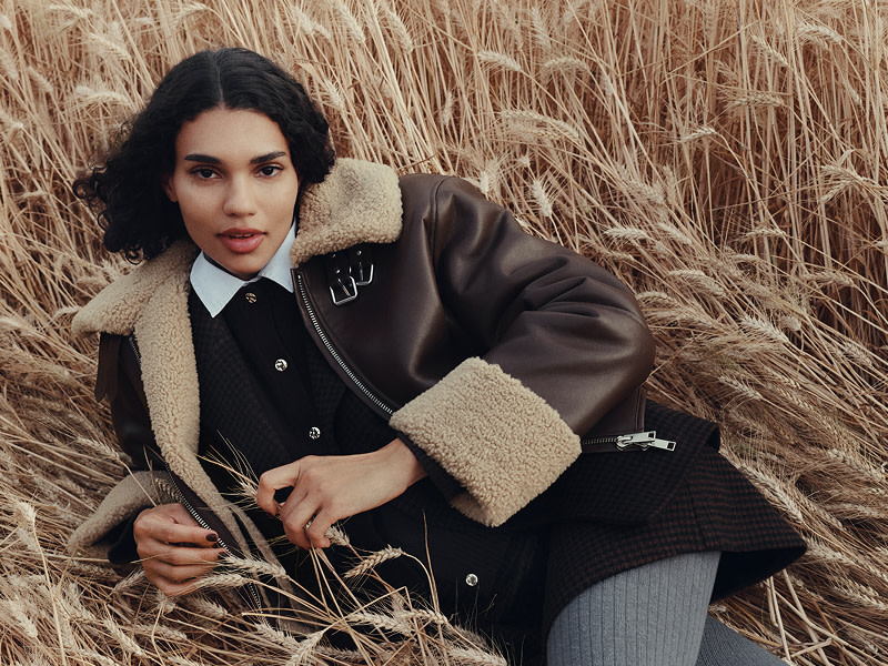 Woman wearing brown aviator jacket