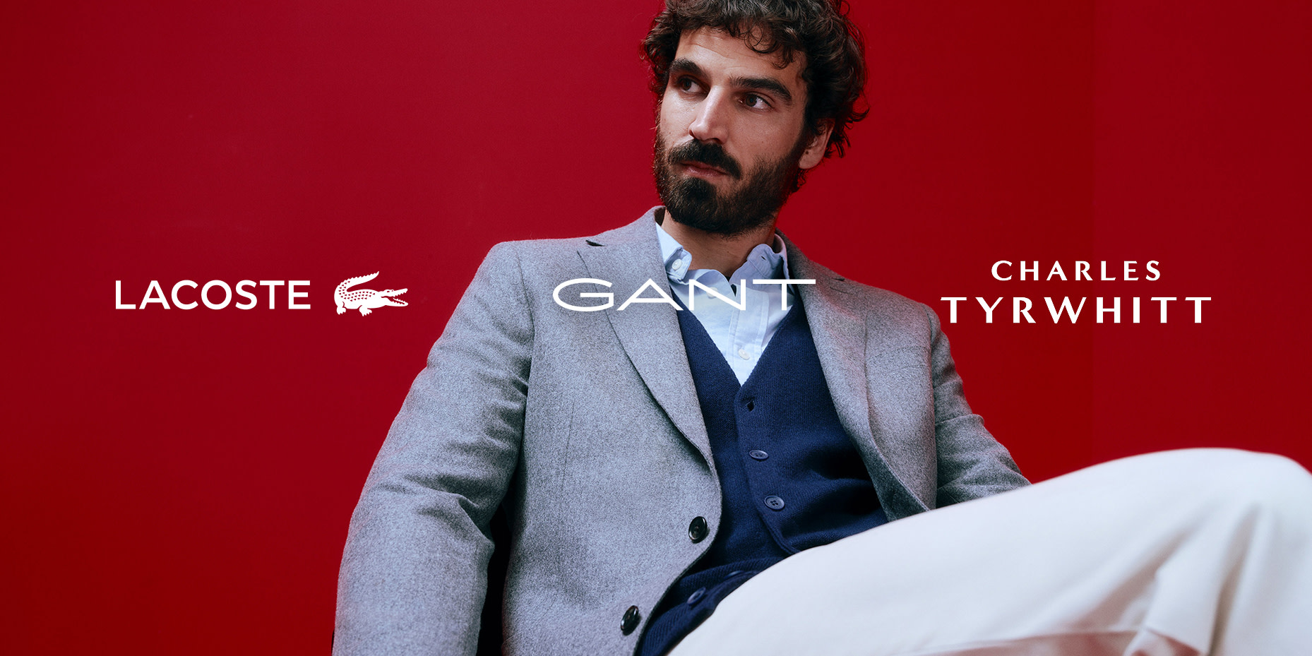 Man wearing a grey blazer and a navy waistcoat