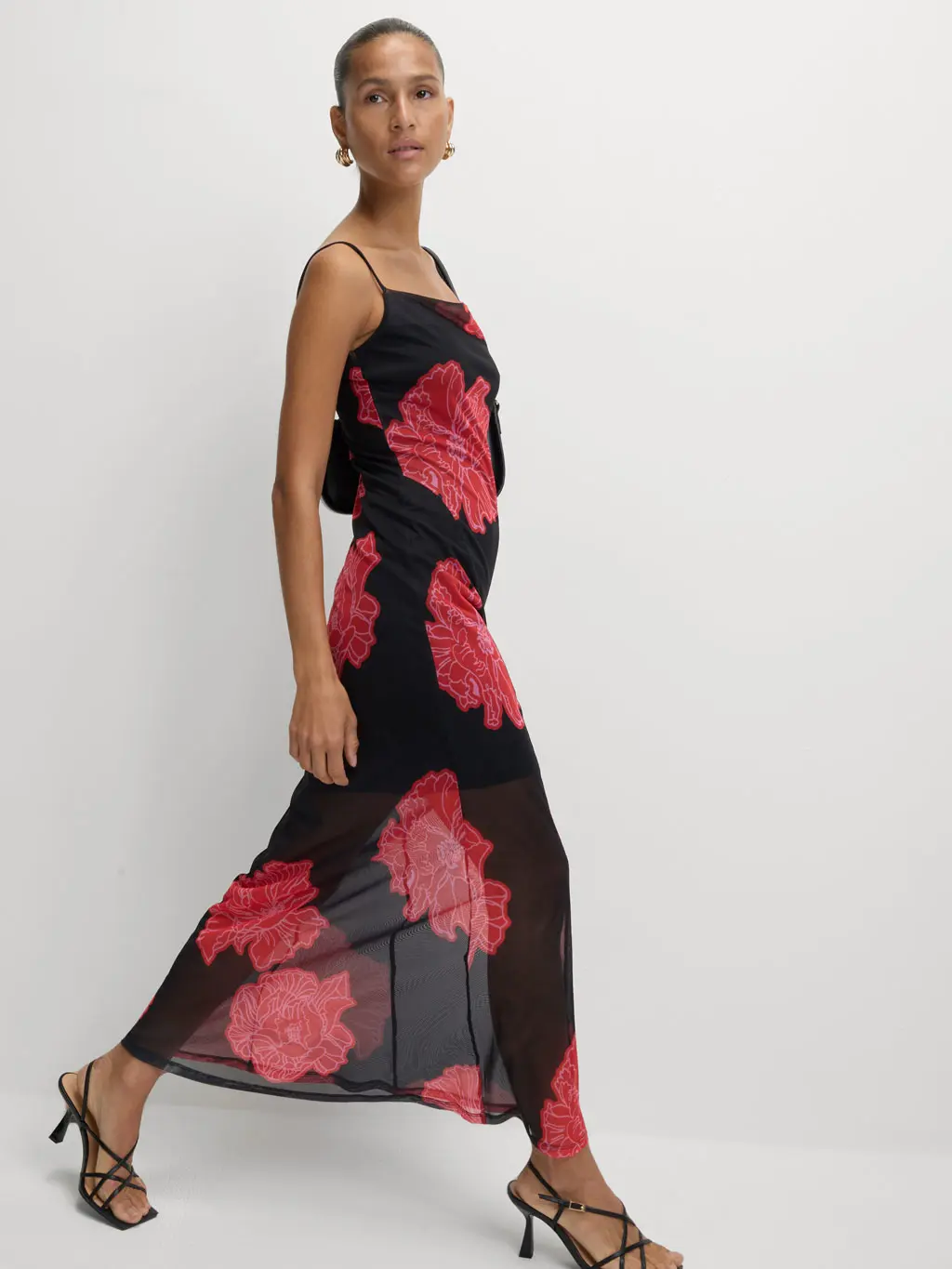 Woman wearing a black and red floral-print dress