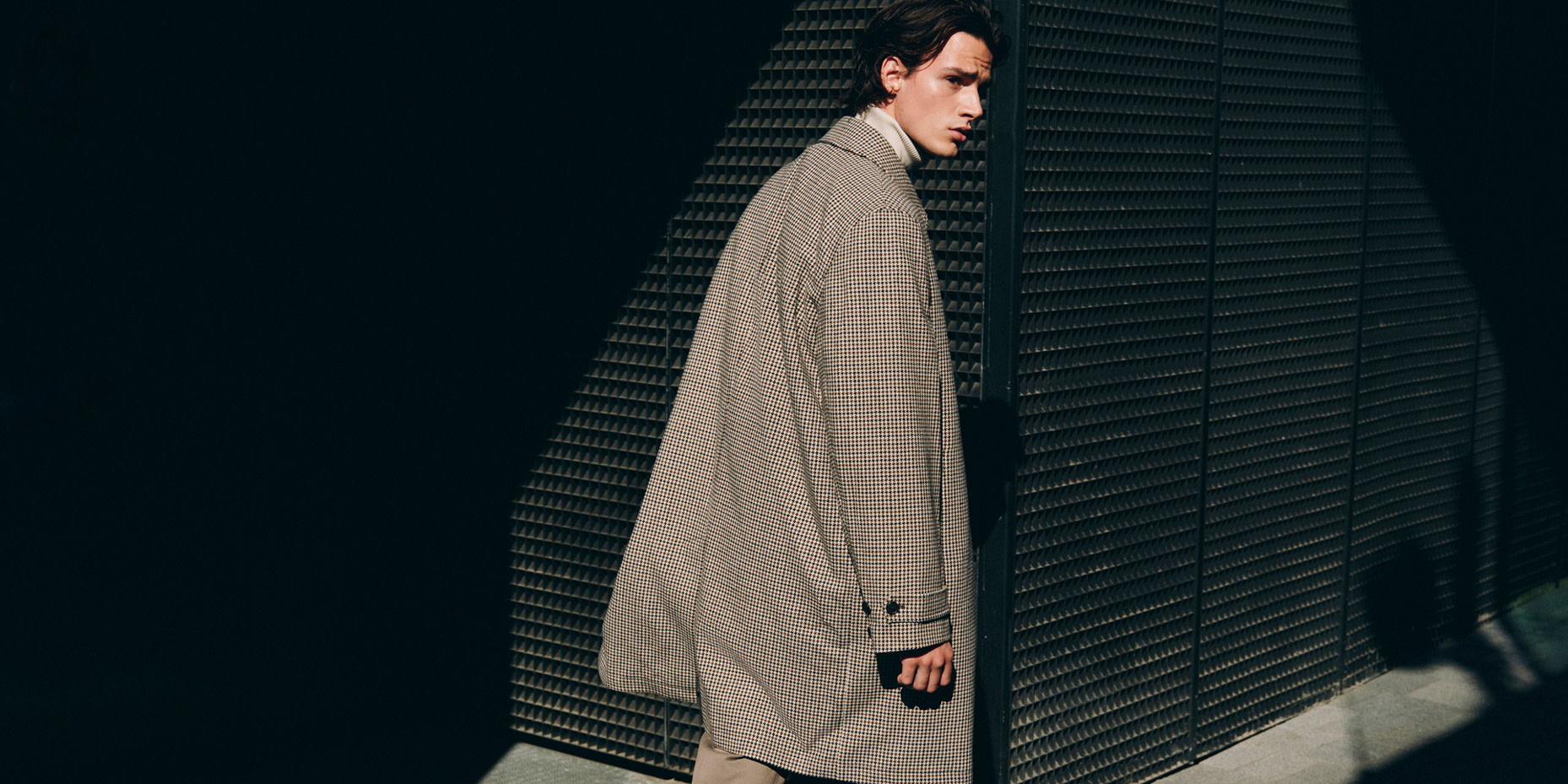 Man wearing grey coat