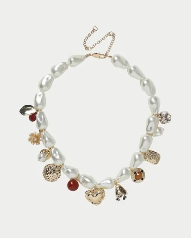 A pearl necklace featuring charms