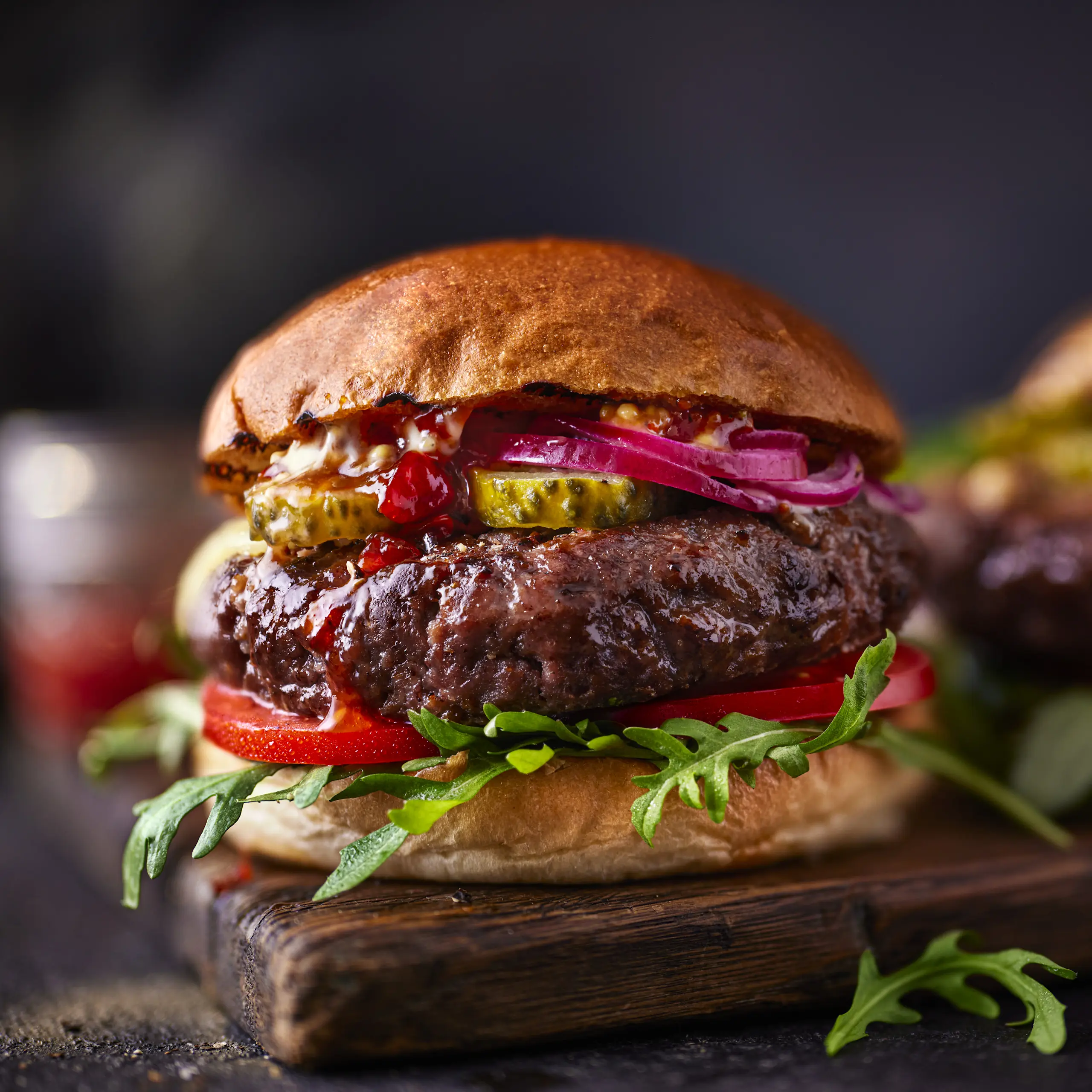Beef burger on wooden cutting board