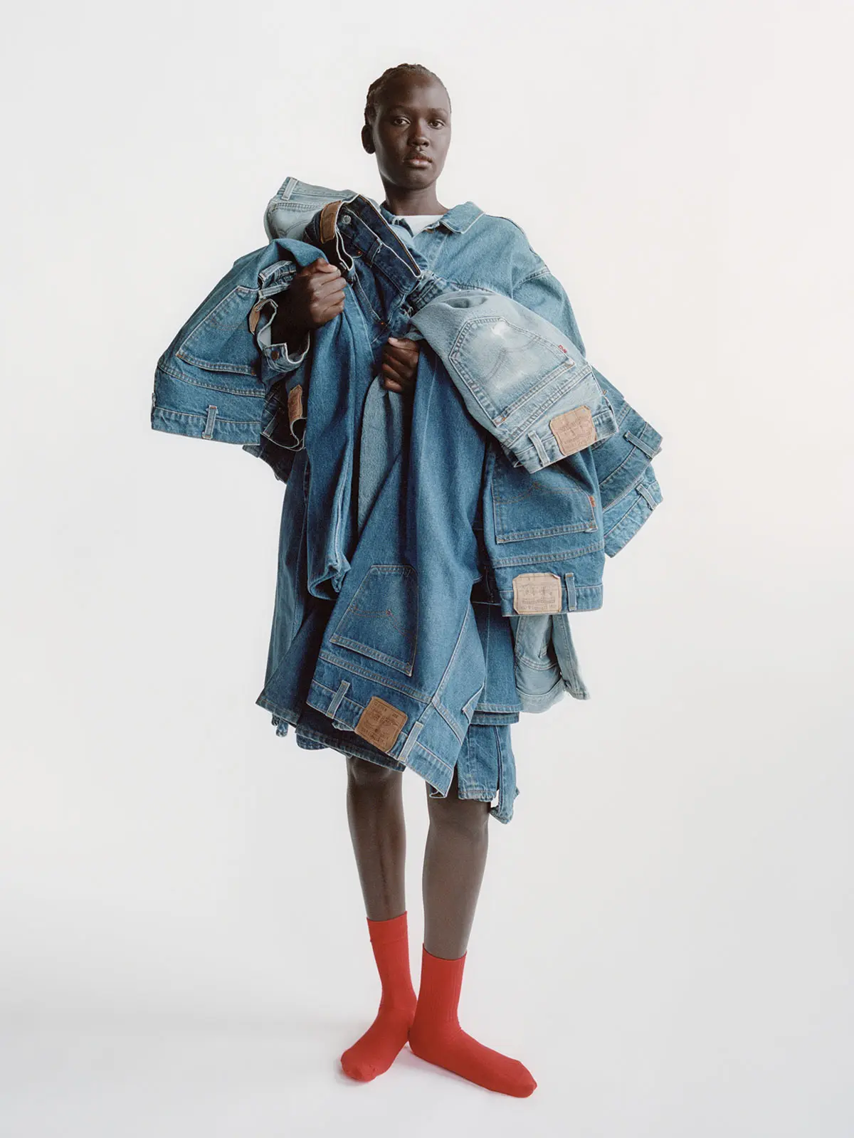Person holding lots of denim