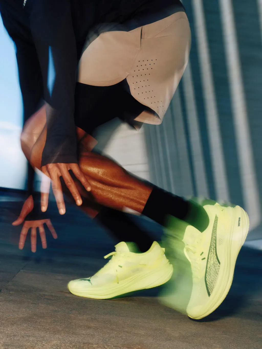 Man wearing yellow Puma Deviate Nitro 3 running shoes