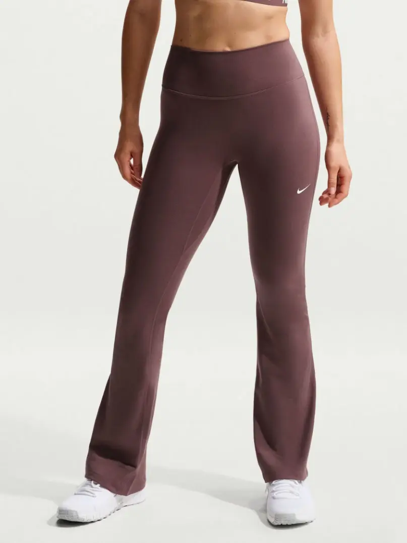 Woman wearing brown flared leggings