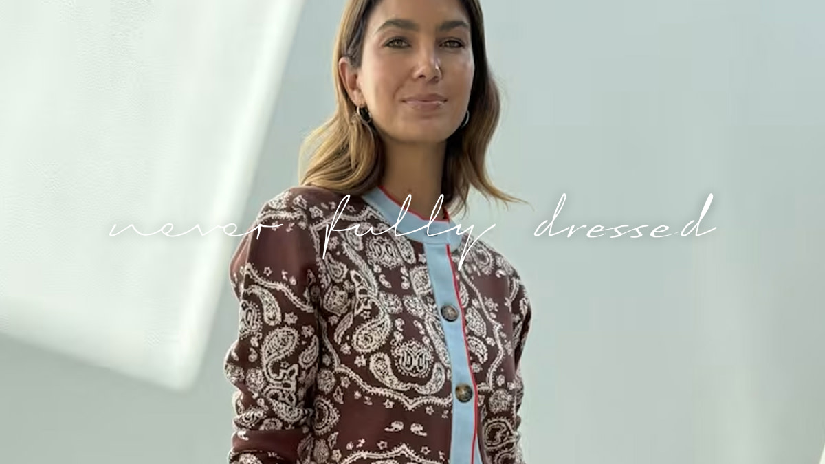 Woman wearing a patterned cardigan by Never Fully Dressed