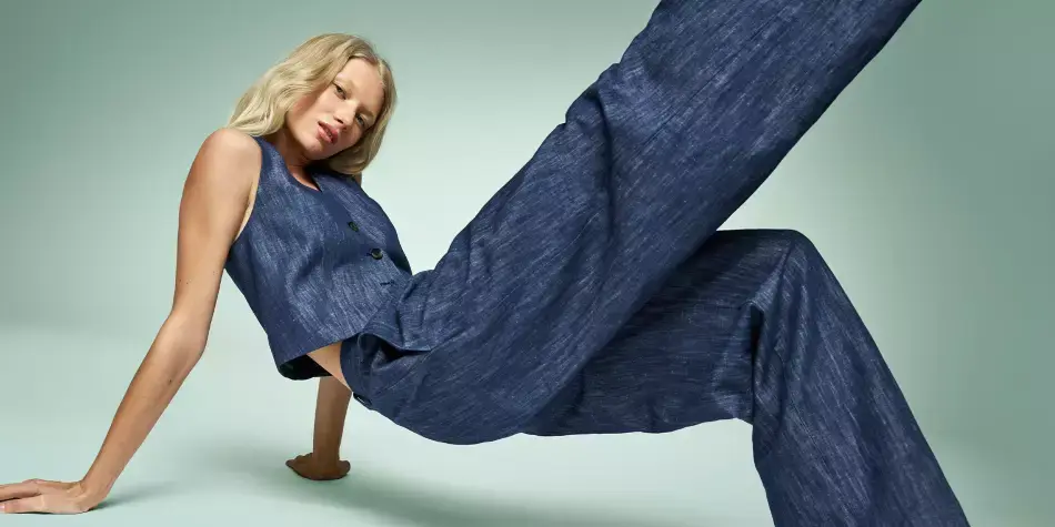 Woman wearing dark blue jeans. Shop jeans