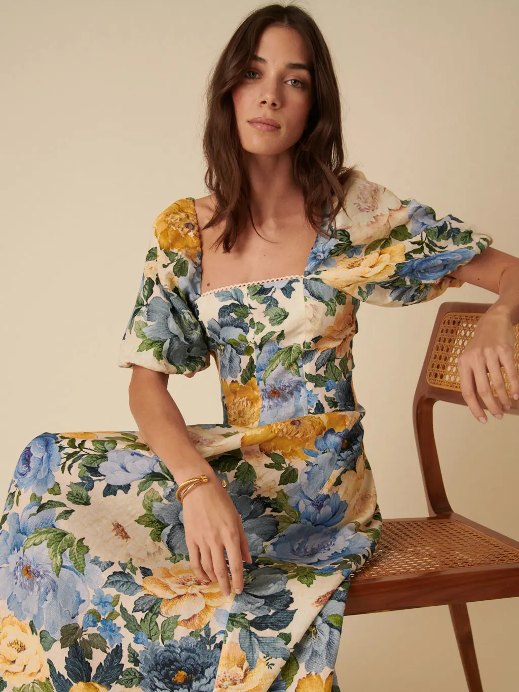 Woman wearing a floral print Nobody's Child dress