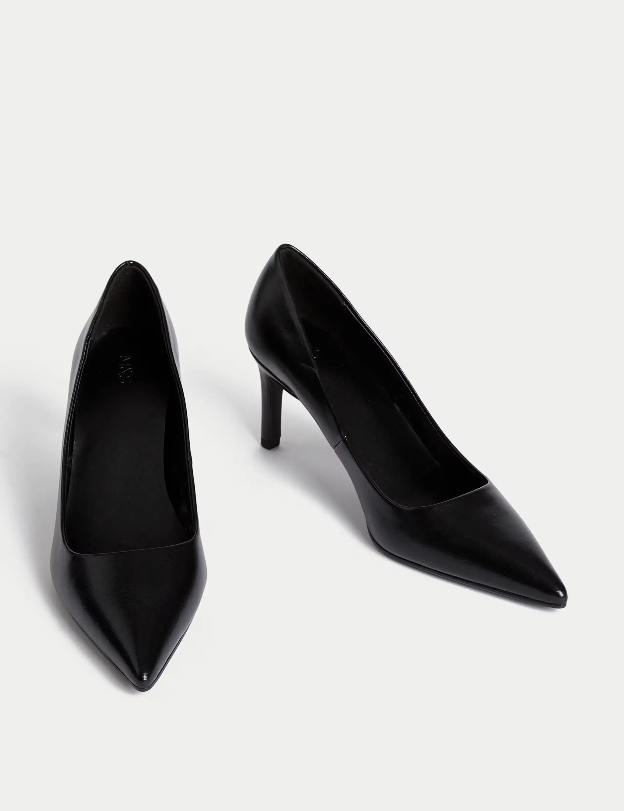 A pair of black stiletto heels