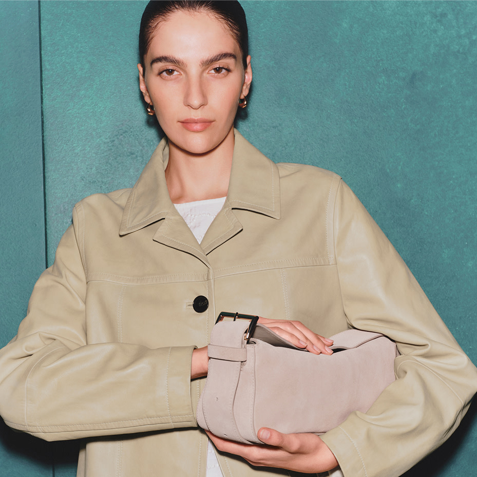 Woman wearing neutral coat