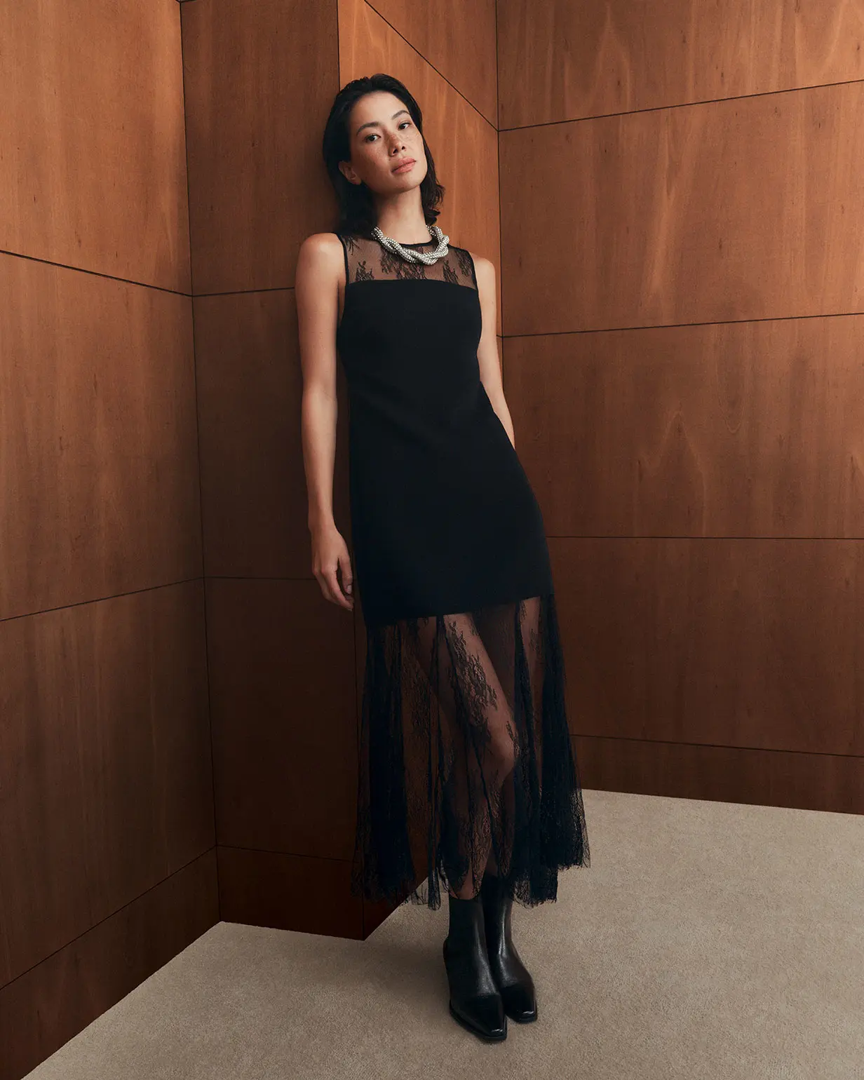 Woman wearing black lace dress