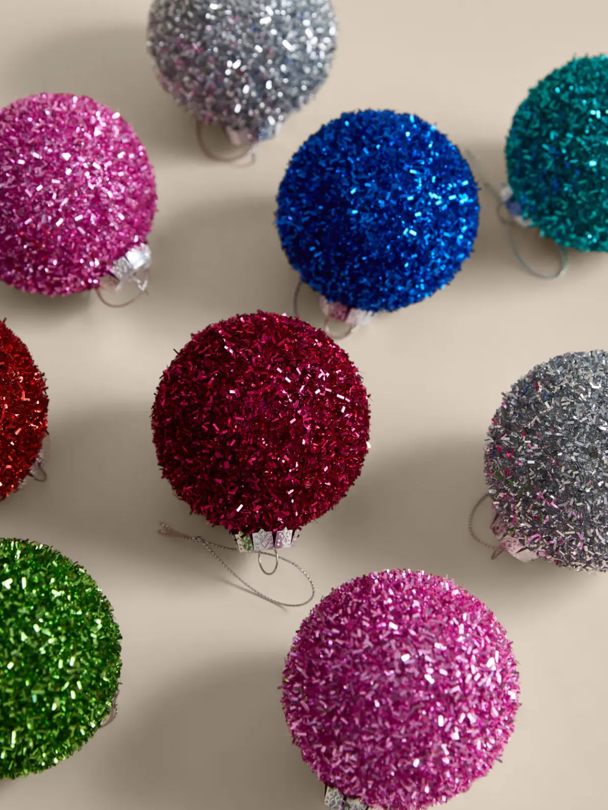 Image of multicoloured tinsel baubles 