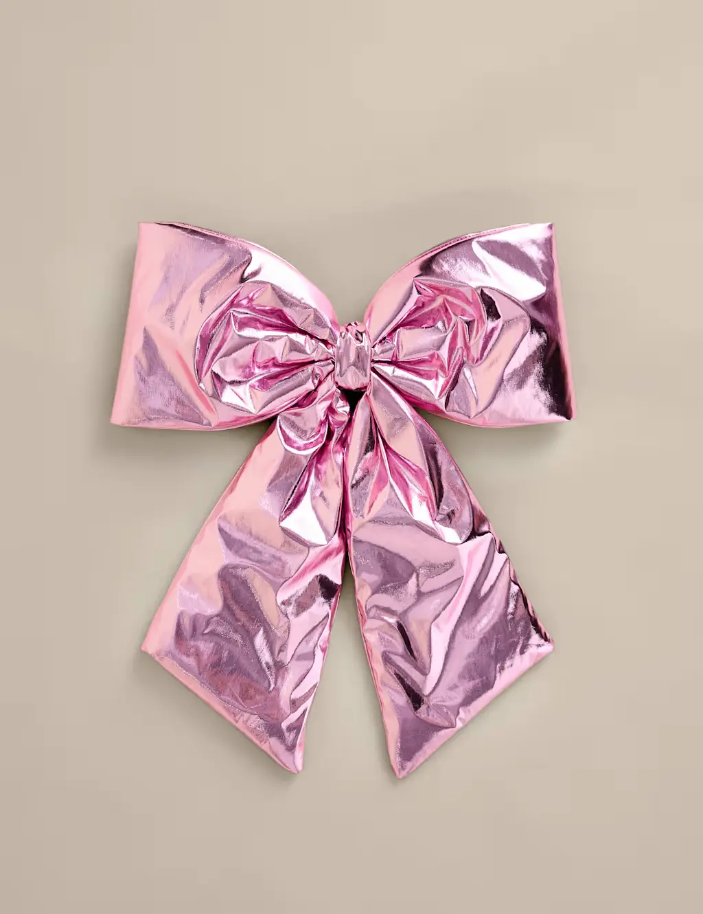 Pink metallic bow tree topper.