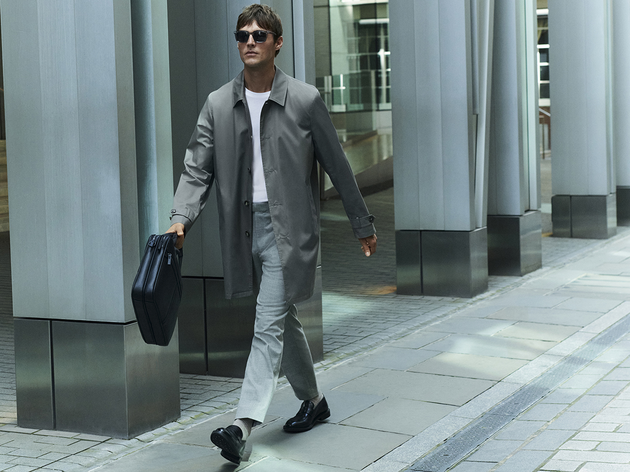 Man wearing long coat and chinos