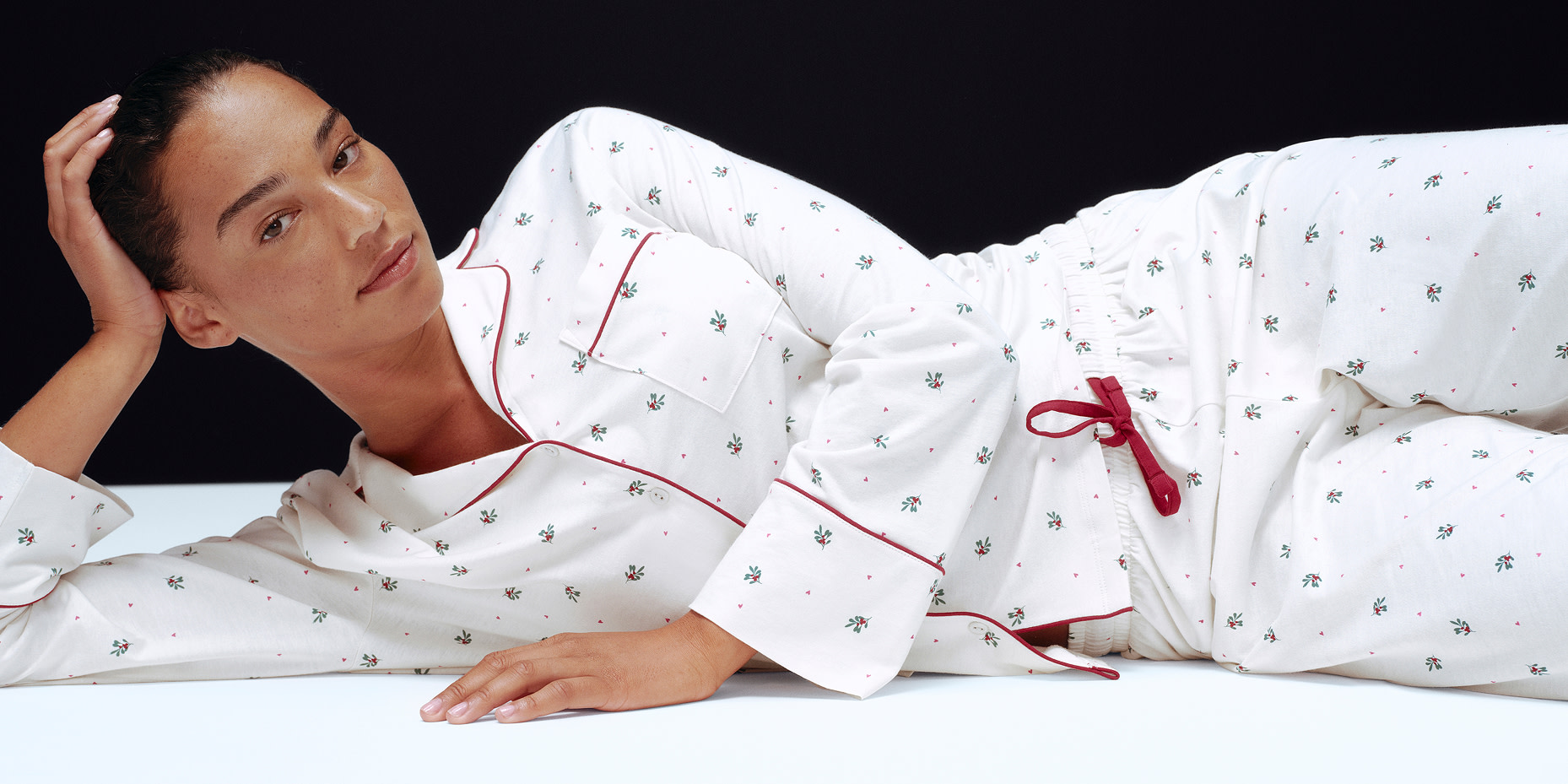 Woman wearing pink and red striped nightwear