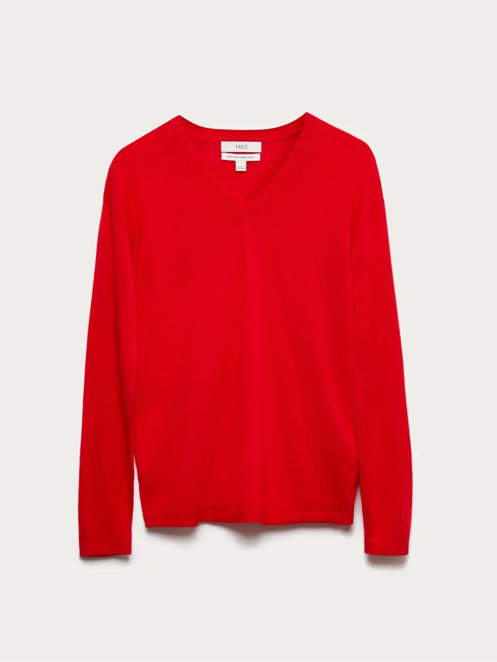 A cutout of a bright red v neck jumper by M&S
