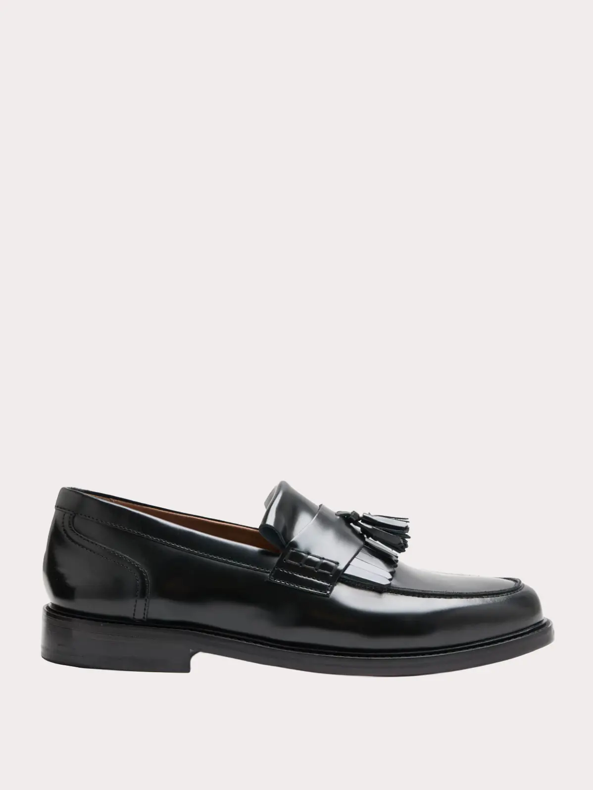 Black loafer with tassel detail